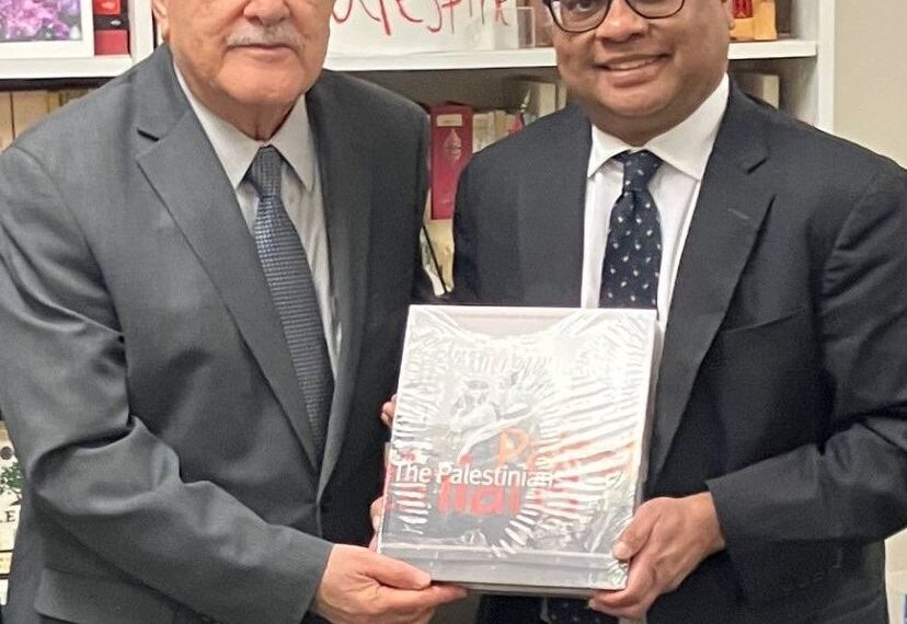 His Excellency Ambassador Riad Mansour of Palestine handing over a gift of a precious book on Palestine to AUW Founder Mr. Kamal Ahmad.