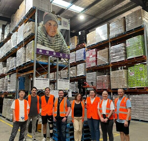 Employees from Allianz Partners Australia volunteering at the Foodbank Queensland warehouse.